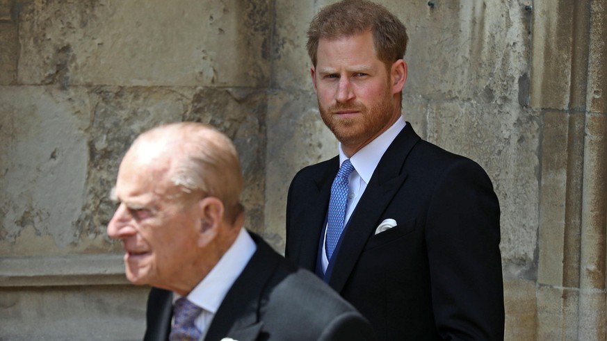 WINDSOR, ENGLAND - MAY 18: Prince Philip, Duke of Edinburgh and Prince Harry, Duke of Sussex leave after the wedding of Lady Gabriella Windsor to Thomas Kingston at St George&#039;s Chapel, Windsor Ca ...