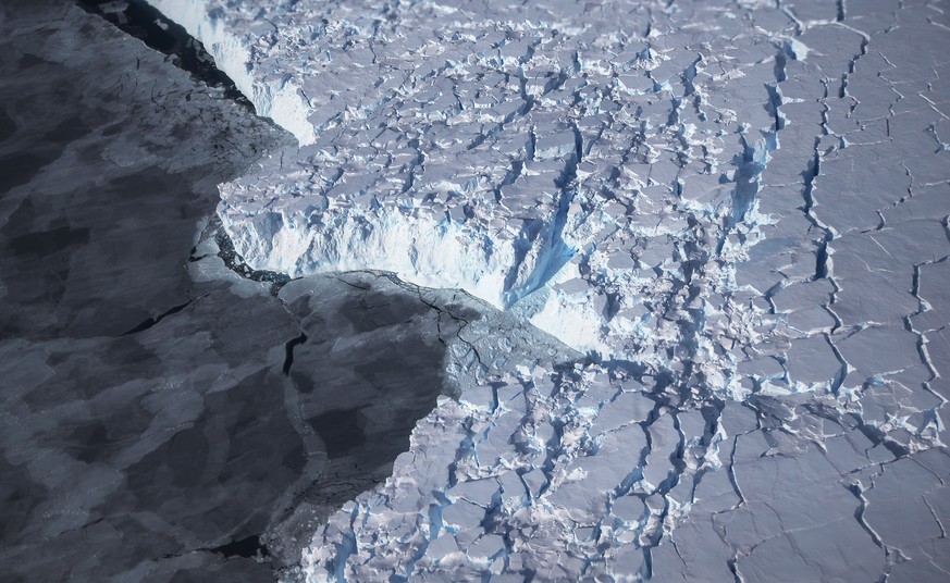 ANTARCTICA - OCTOBER 28: Ice is viewed near the coast of West Antarctica from a window of a NASA Operation IceBridge airplane on October 28, 2016 in-flight over Antarctica. NASA&#039;s Operation IceBr ...