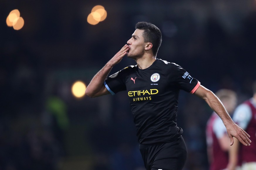 BURNLEY, ENGLAND - DECEMBER 03: Rodri of Manchester City celebrates scoring the third goal of the game during the Premier League match between Burnley FC and Manchester City at Turf Moor on December 3 ...