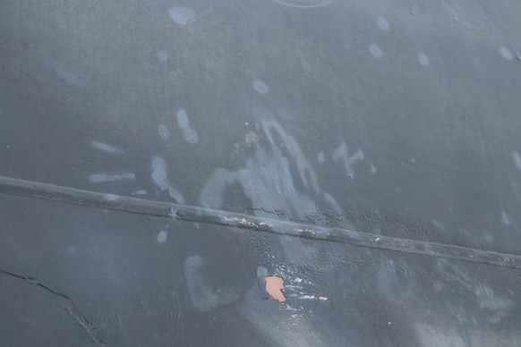 A U.S. military image released by the Pentagon in Washington on June 17 shows what the Navy says is the aluminum and green composite material left behind following the removal of an unexploded limpet  ...