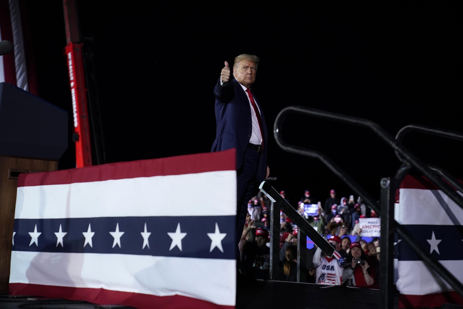 President Donald Trump gives as thumbs up after speaking during a campaign rally at MBS International Airport, Thursday, Sept. 10, 2020, in Freeland, Mich. (AP Photo/Evan Vucci)