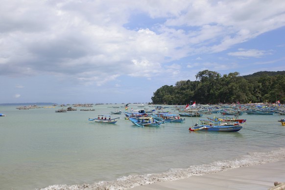 October 23, 2018 - Pangandaran, West Java, Indonesia - Fishing boats are seen leaning on the Pangandaran beach. Pangandaran Beach, one of the best beaches in West Java which is famous for its not so b ...