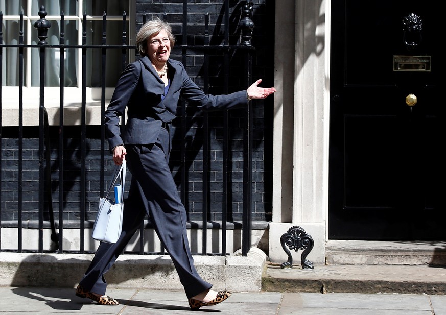 FILE PHOTO: Britain&#039;s Home Secretary Theresa May leaves after a cabinet meeting at number 10 Downing Street in London, Britain, July 12, 2016. REUTERS/Peter Nicholls/File Photo