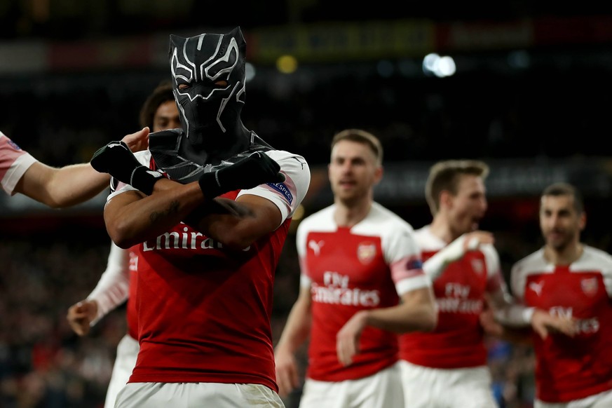 14th March 2019, Emirates Stadium, London, England; UEFA Europa League football, round of 16, second leg, Arsenal versus Rennes; Pierre-Emerick Aubameyang of Arsenal celebrates in a spiderman mask as  ...