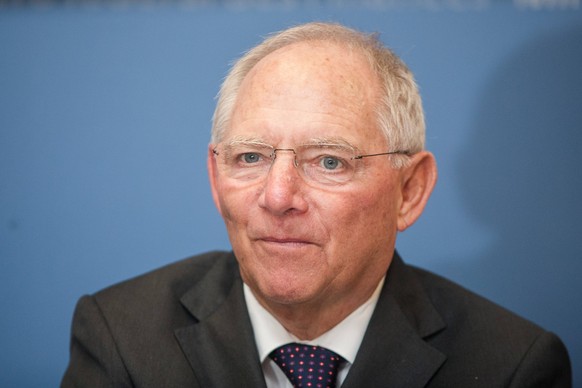 Oct. 7, 2014 - Berlin, Berlin, Germany - German Finance Minister Wolfgang Schaueble and the President of Deutsches KInderhilfswerk Thomas Krueger (unseen) call for donation of foreign coins at the Min ...