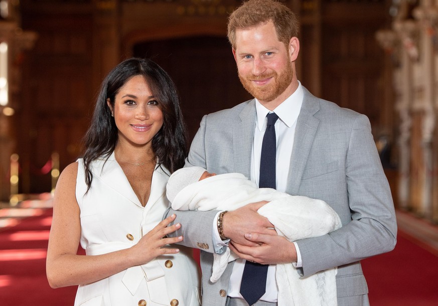 WINDSOR, ENGLAND - MAY 08: Prince Harry, Duke of Sussex and Meghan, Duchess of Sussex, pose with their newborn son Archie Harrison Mountbatten-Windsor during a photocall in St George&#039;s Hall at Wi ...
