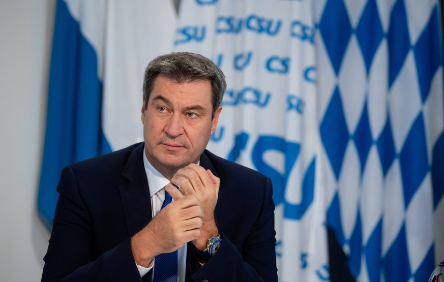 Bavarian State Prime Minister and Christian Social Union (CSU) party leader Markus Soeder sits in his office as he attends a virtual CSU party convention in Munich, Germany, September 26, 2020. Sven H ...
