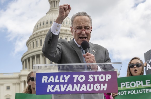FILE - In this Aug. 1, 2018 file photo, Senate Minority Leader Chuck Schumer, D-N.Y., joins protesters objecting to President Donald Trump&#039;s Supreme Court nominee Brett Kavanaugh at a rally Capit ...