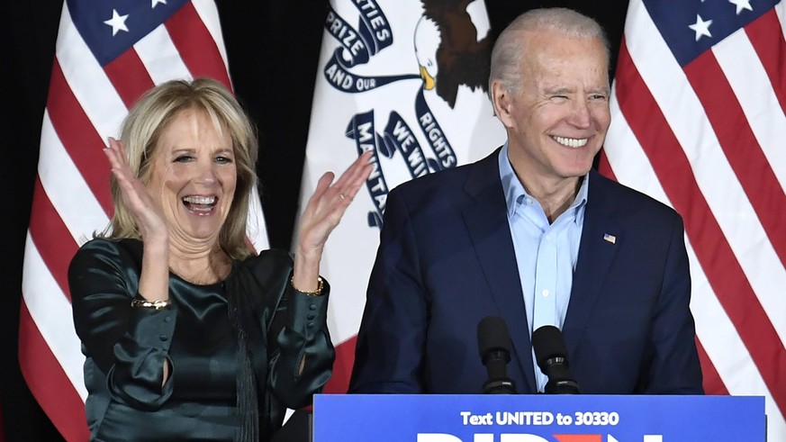 Democratic presidential candidate for 2020 former Vice President Joe Biden and his wife Dr. Jill Biden are all smiles as they arrive to address supporters at a Caucus Night event, at Drake University  ...