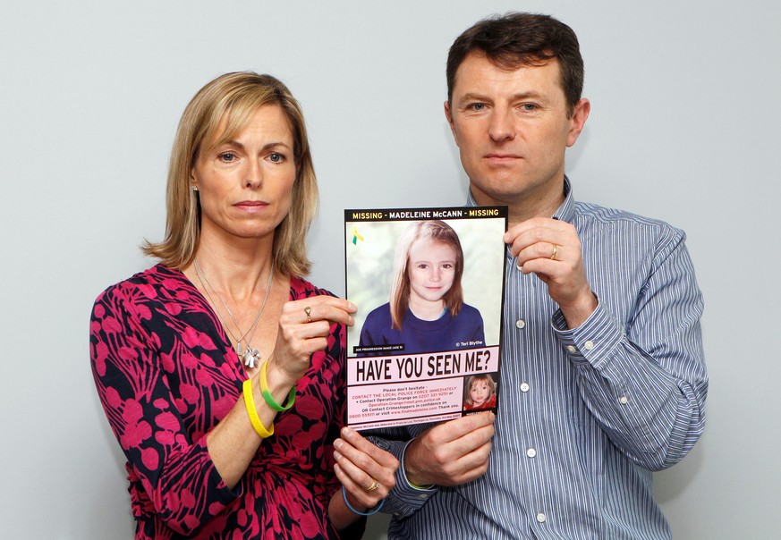 FILE PHOTO: Kate and Gerry McCann pose with a computer generated image of how their missing daughter Madeleine might look now, during a news conference in London May 2, 2012. REUTERS/Andrew Winning/Fi ...
