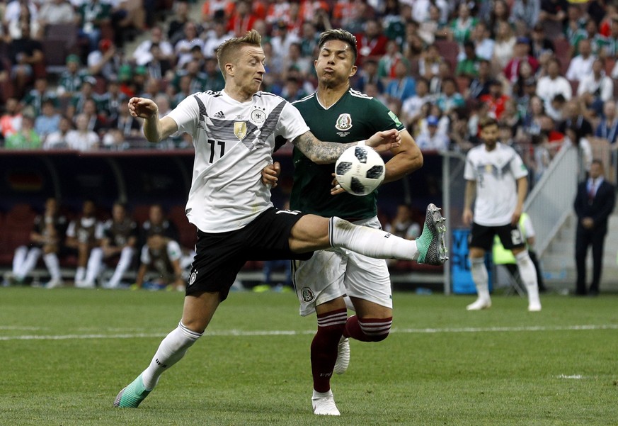 Germany&#039;s Marco Reus, left, fights for the ball with Mexico&#039;s Carlos Salcedo during the group F match between Germany and Mexico at the 2018 soccer World Cup in the Luzhniki Stadium in Mosco ...