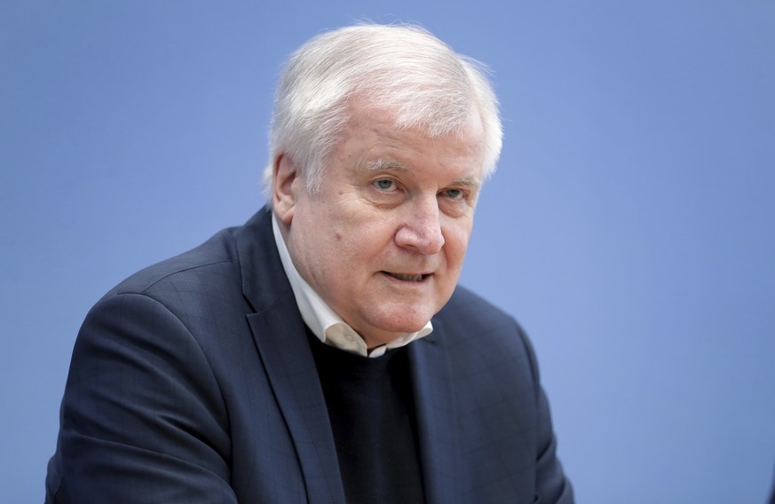 German Interior Minister Horst Seehofer speaks during a press conference in Berlin, Germany, Friday, Feb. 21, 2020 two days after a 43-year-old German man shot and killed several people at several loc ...