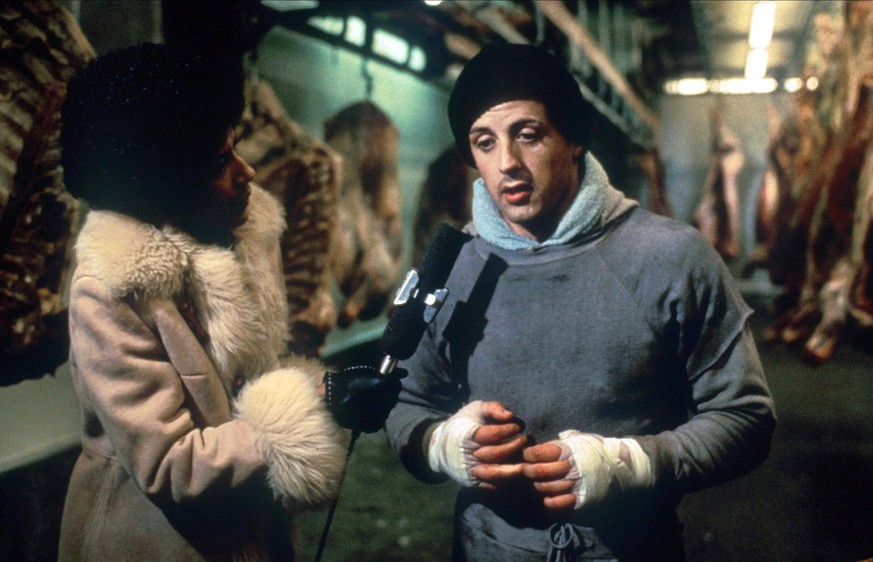 Diana Lewis &amp; Sylvester Stallone Characters: TV Commentator, Rocky Balboa Film: Rocky USA 1976 Director: John G. Avildsen 21 November 1976 AQUARIUS LIBRARY PUBLICATIONxINxGERxSUIxAUTxONLY Copyrigh ...