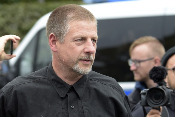 Far right activist Goetz Kubitschek arrives at a demonstration in Chemnitz, eastern Germany, Saturday, Sept. 1, 2018, after several nationalist groups called for marches protesting the killing of a Ge ...