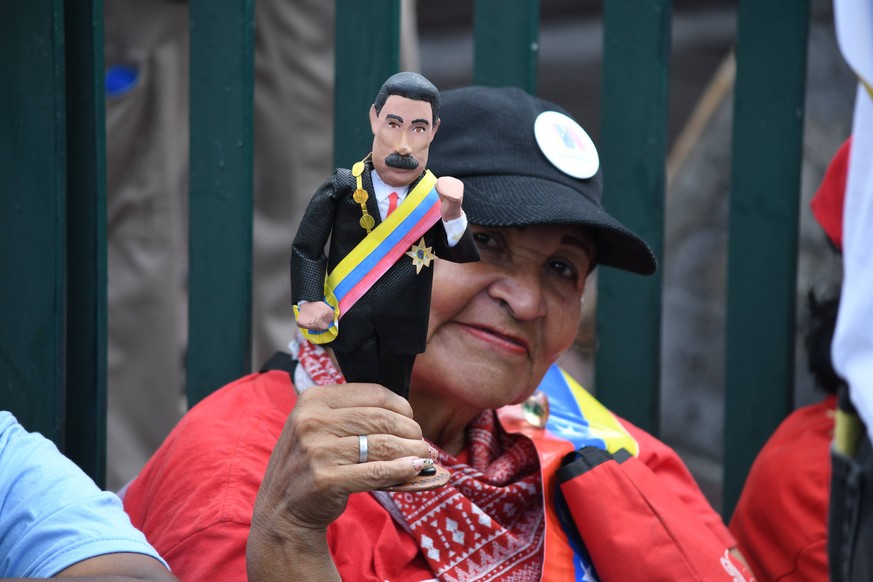 May 17, 2018 - Caracas, Distrito Capital, Venezuela - A woman seen holding a little statue of Nicolas Maduro during the rally..Supporters gathered to hear President Nicolas Maduro s speech during his  ...