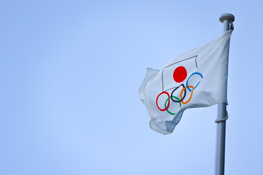 Olympic Flag with hinomaru in front of Japan Olympic Museum in Shinjuku on March 3, 2021. - 20210315_PD8308