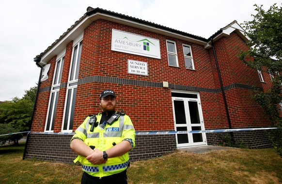 A police officer stands in front of Amesbury Baptist Church, which has been cordoned off after two people were hospitalised and police declared a &#039;major incident&#039;, in Amesbury, Wiltshire, Br ...