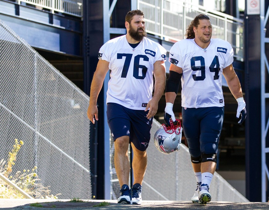 August 5, 2016; Foxborough, MA, USA; New England Patriots tackle Sebastian Vollmer (76) and New England Patriots defensive lineman Markus Kuhn (94) takes the field during New England Patriots Training ...