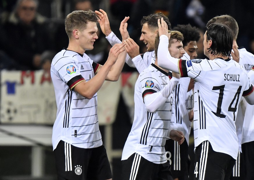 Germany&#039;s Matthias Ginter, left, is celebrated after he scored the opening goal during the Euro 2020 group C qualifying soccer match between Germany and Belarus in Moenchengladbach, Germany, Satu ...