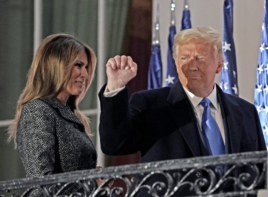 October 26, 2020, Washington, District of Columbia, USA: United States President Donald J. Trump gestures to guests as he and First lady Melania Trump return to the Residence following the ceremony wh ...