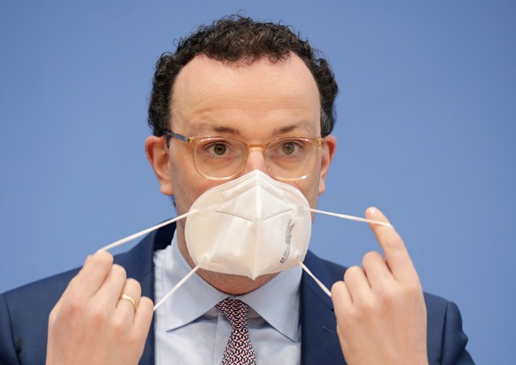 Germany&#039;s Health Minister Jens Spahn takes off his mask during a news conference on the coronavirus disease (COVID-19) pandemic in Berlin, Germany, Friday, Feb. 26, 2021. (Hannibal Hanschke/Pool  ...