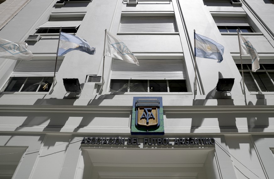 Flags fly in front of the Argentine Football Association, AFA, headquarters, in Buenos Aires, Argentina, Thursday, Nov. 16, 2017. The former CEO of the sports marketing company Torneos y Competencias  ...