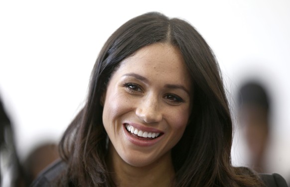 FILE - In this Wednesday April 18, 2018 file photo, Meghan Markle attends a reception with Britain&#039;s Prince Harry for the Commonwealth Youth Forum at the Queen Elizabeth II Conference Centre, Lon ...
