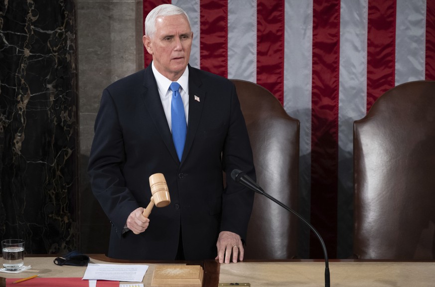 Vice President Mike Pence officiates as a joint session of the House and Senate convenes to confirm the Electoral College votes cast in November&#039;s election, at the Capitol in Washington, Wednesda ...