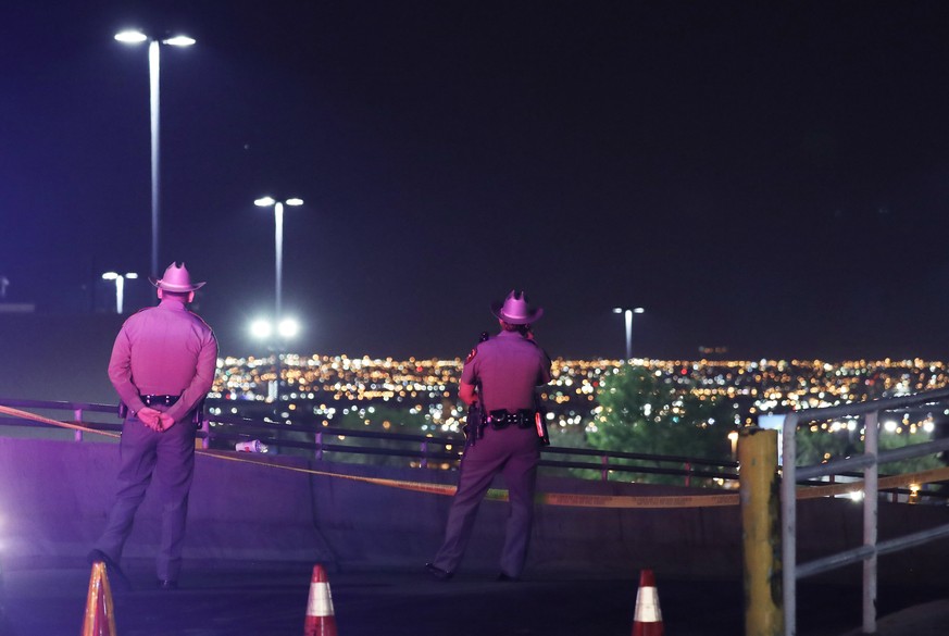EL PASO, TEXAS - AUGUST 03: Police keep watch outside Walmart near the scene of a mass shooting which left at least 20 people dead on August 3, 2019 in El Paso, Texas. A 21-year-old male suspect was t ...