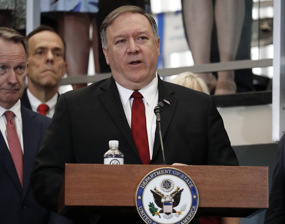 Secretary of State Mike Pompeo announces a new &#039;ethos&#039; statement as he addresses employees in the lobby staircase of the U.S. State Department headquarters in Washington, Friday, April 25, 2 ...
