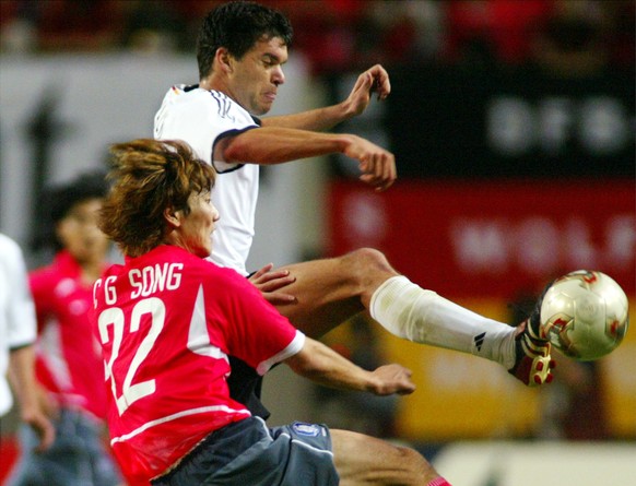 Germany&#039;s Michael Ballack, right, is challenged by South Korea&#039;s Song Chong Gug, during the 2002 World Cup semifinal match between Germany and South Korea, at the Seoul World Cup stadium in  ...