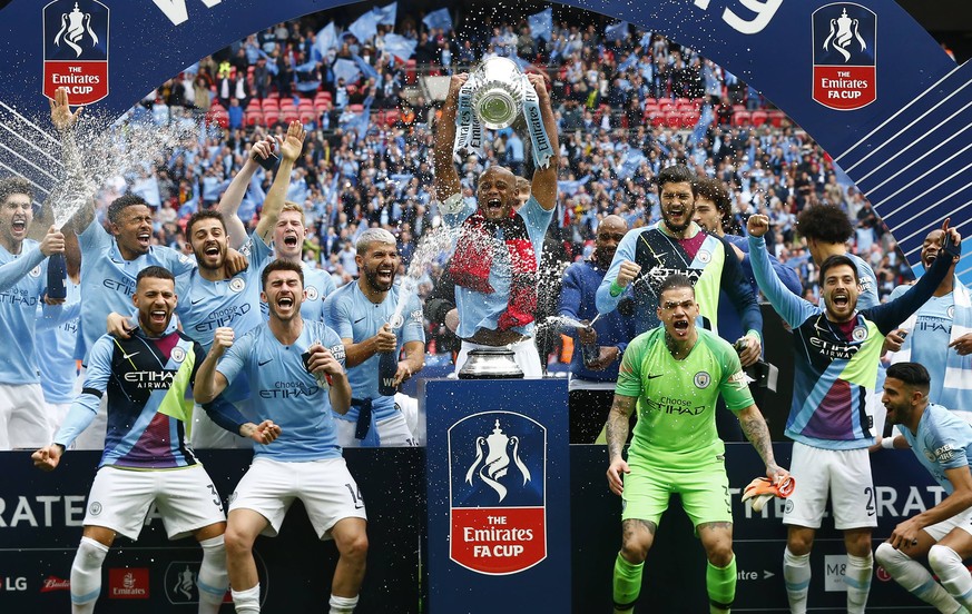 May 18, 2019 - London, England, United Kingdom - Manchester City s Vincent Kompany with Trophy.during FA Cup Final match between Manchester City and Watford at Wembley stadium, London on 18 May 2019., ...