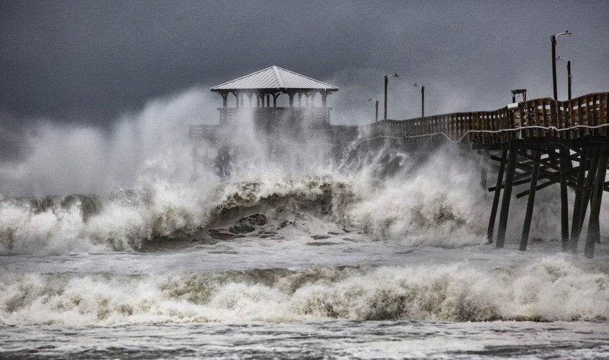 Waves slam the Oceana Pier &amp; Pier House Restaurant in Atlantic Beach, N.C., Thursday, Sept. 13, 2018 as Hurricane Florence approaches the area. (Travis Long/The News &amp; Observer via AP)