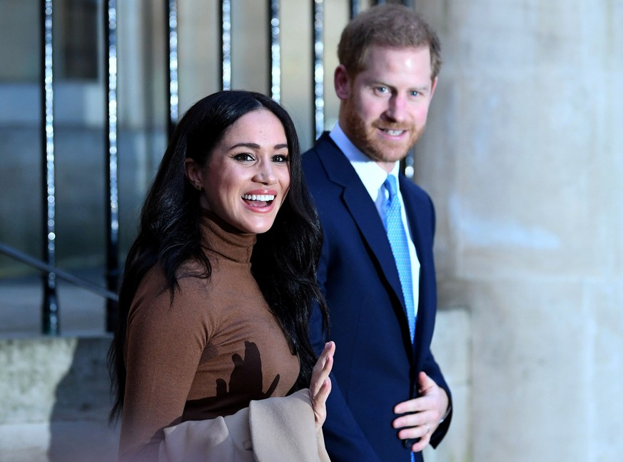 Britain&#039;s Prince Harry and his wife Meghan, Duchess of Sussex react as they leave after their visit to Canada House in London, Britain January 7, 2020. Daniel Leal-Olivas/Pool via REUTERS