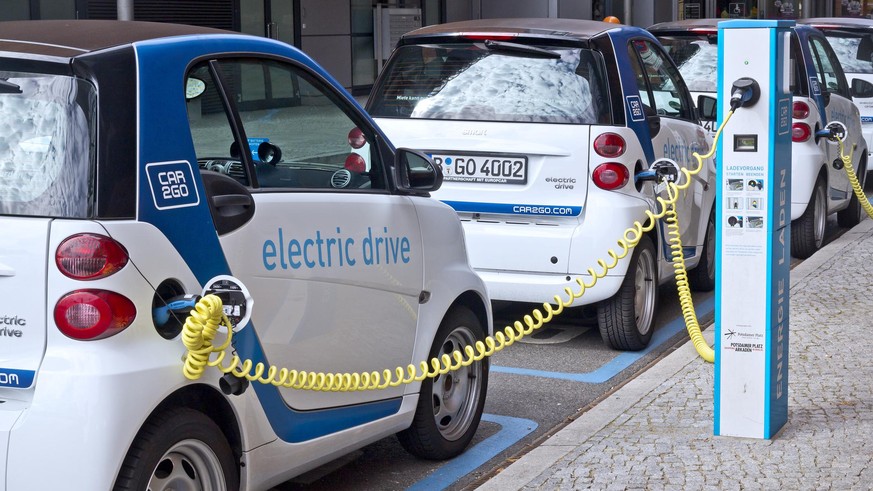 Berlin,Germany - September 08, 2013:Smart electric cars connected to the chargers on the street in the center of Berlin