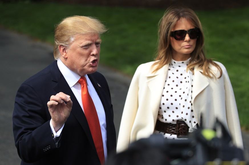 President Donald Trump speaks to reporters before leaving the White House in Washington, Wednesday, April 24, 2019, for a trip to Atlanta with first lady Melania Trump to participate an opioids summit ...