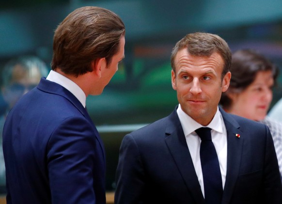 French President Emmanuel Macron talks with Austrian Chancellor Sebastian Kurz as they attend an European Union leaders summit in Brussels, Belgium, June 28, 2018. REUTERS/Francois Lenoir