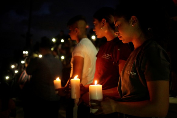Mourners taking part in a vigil at El Paso High School after a mass shooting at a Walmart store in El Paso, Texas, U.S. August 3, 2019. REUTERS/Jose Luis Gonzalez