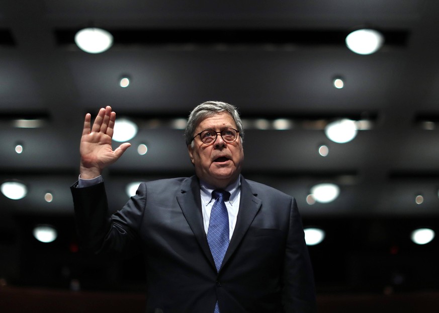 U.S. Attorney General William Barr watches an exhibit as he testifies before the House Judiciary Committee at the U.S. Capitol Visitors Center in Washington, DC, on Tuesday, July 28, 2020. In his firs ...