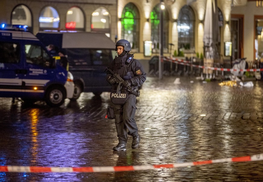 A police officer guards evidence at the scene of an incident in Trier, Germany, Tuesday, Dec. 1, 2020. German police say people have been killed and several others injured in the southwestern German c ...