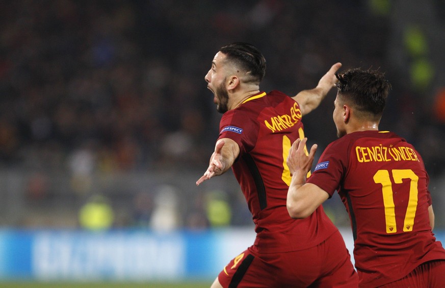 Italy Soccer Uefa Champions League: Roma vs FC Barcelona Barca Roma s Kostas Manolas, right, celebrates with his teammate Cengiz Under after scoring during the Champions League quarter final second le ...