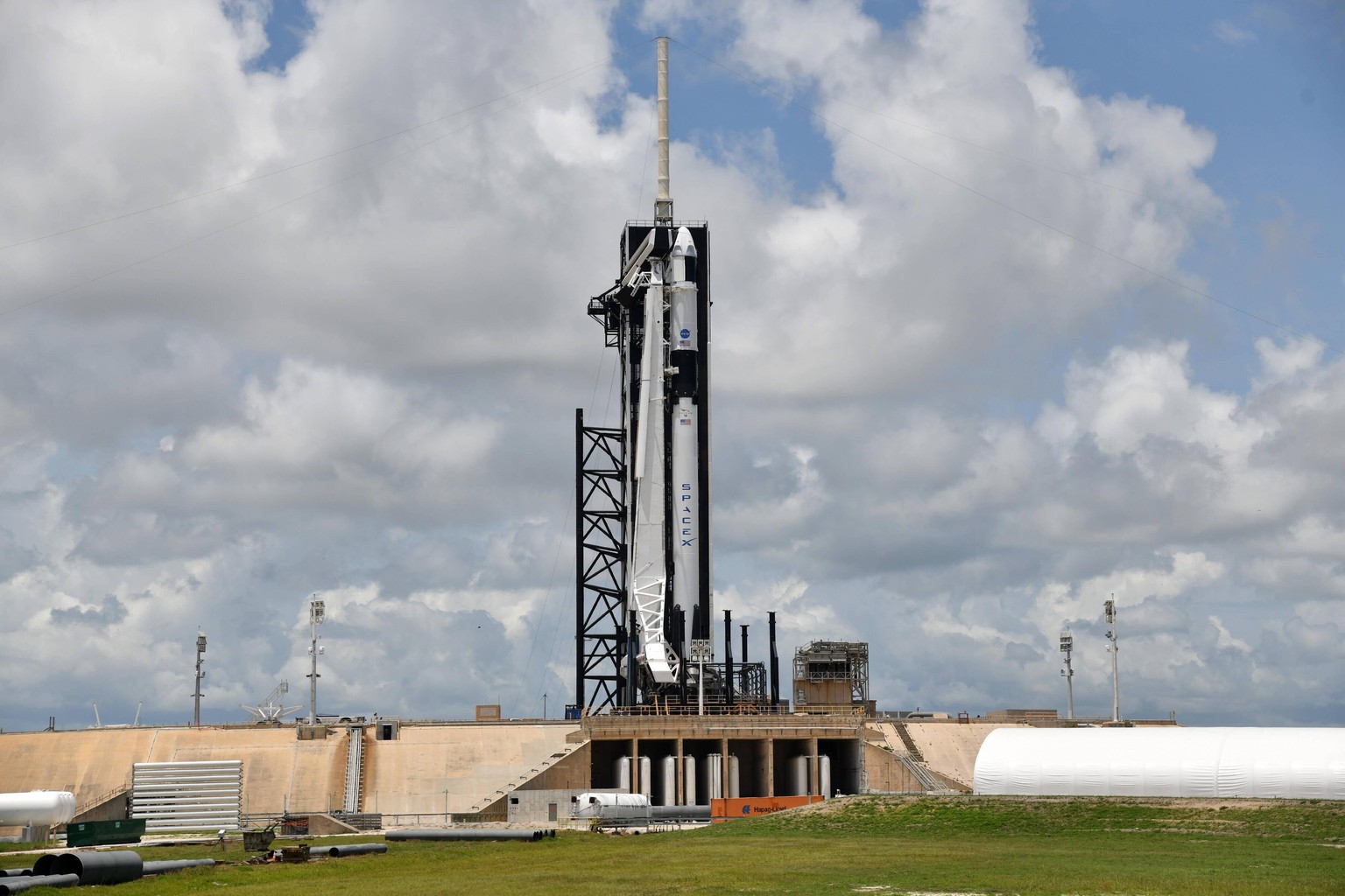 A SpaceX Crew Dragon spacecraft and Falcon 9 rocket stands on Complex 39A as they are prepared for the launch of the first manned mission for NASA from the Kennedy Space Center, Florida on Friday May  ...