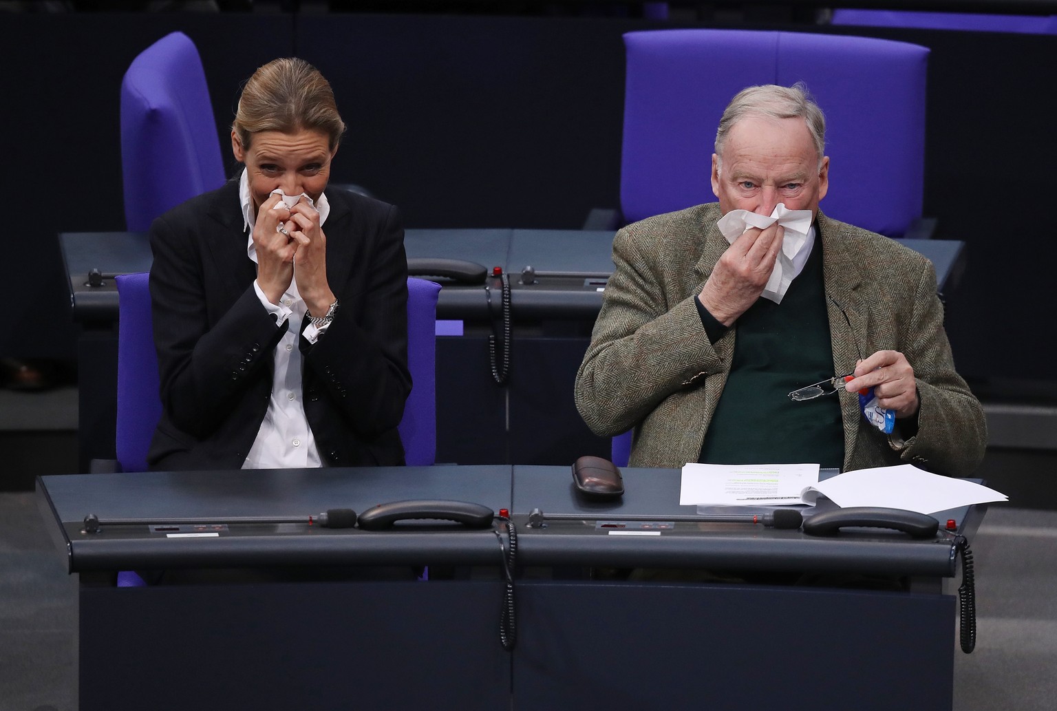 BERLIN, GERMANY - MARCH 14: Alice Weidel and Alexander Gauland, Bundestag faction leaders of the right-wing Alternative for Germany (AfD) political party, blow their noses shortly before German Chance ...