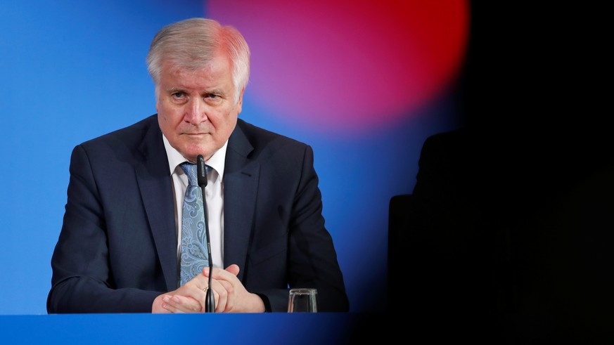 German Interior Minister Horst Seehofer attends a news conference a day after a man killed an 8-year-old boy by pushing him on to train tracks at Frankfurt&#039;s main train station, in Berlin, German ...