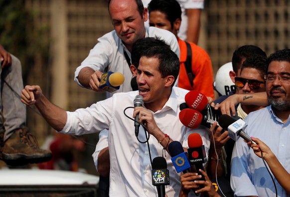 Venezuelan opposition leader Juan Guaido, who many nations have recognized as the country&#039;s rightful interim ruler, speaks during a protest against Venezuelan President Nicolas Maduro&#039;s gove ...