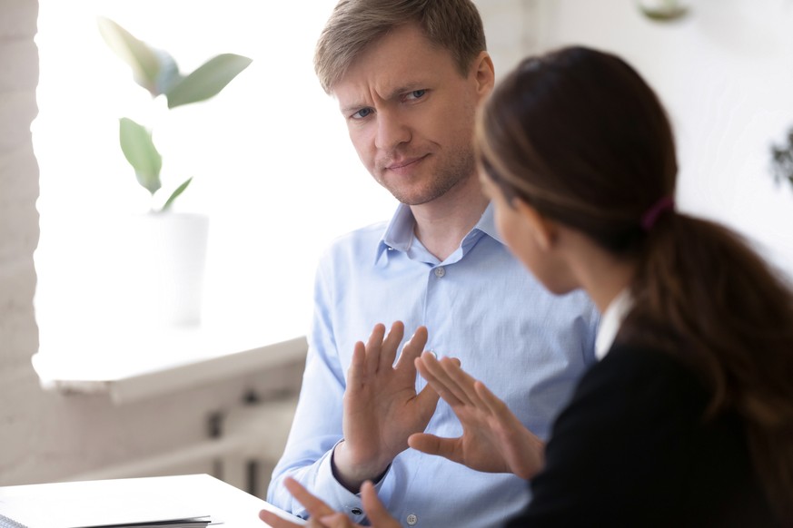 Annoyed man discussing working moments and disagreed with colleague. Hr manager showing with hands gesture protest and rejection want to finish unsuccessful job interview. Bad first impression concept